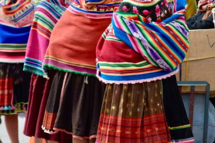 view of a group of people on a street wearing traditional folk costumes